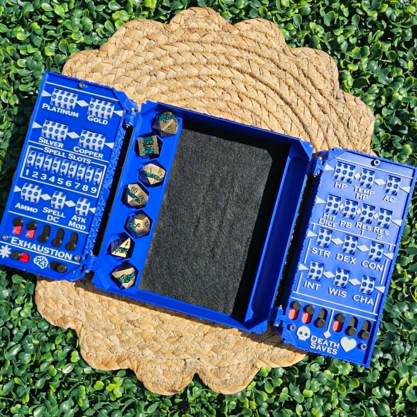 Blue dice tray with dice on a textured surface